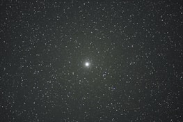 A confident entrepreneur looking at a glowing star map, representing clarity and growth through cosmic insight.