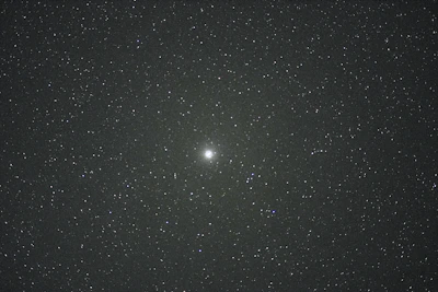 A detailed natal star chart with vibrant constellations glowing against a dark sky background.