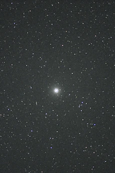 A vibrant night sky filled with stars and a telescope pointing upwards, symbolizing the wonder of astrophysics.