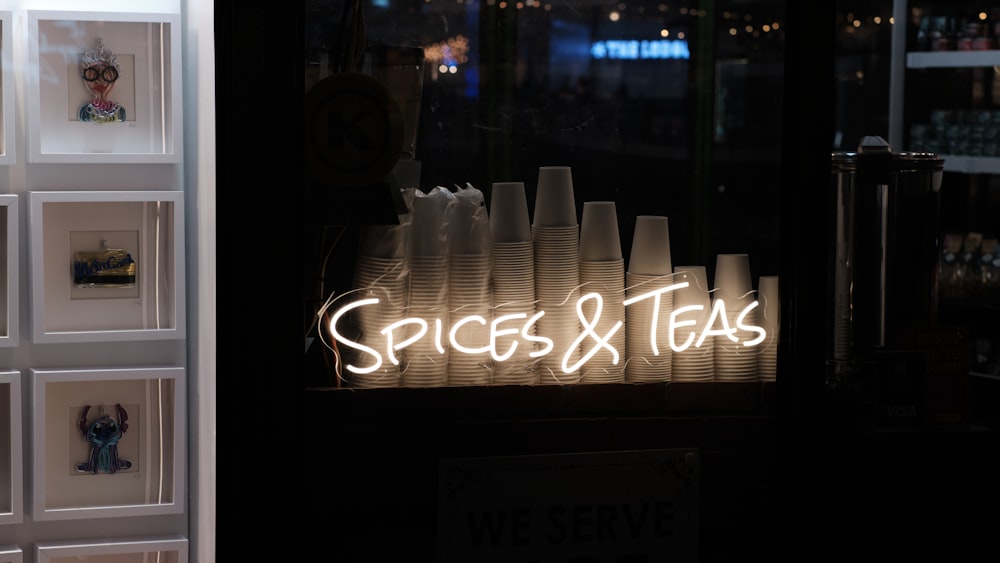 a store front with a neon sign in the window