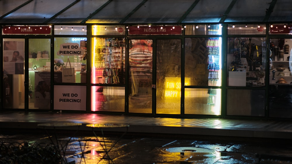 a store front lit up with neon lights