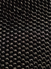 A close-up of a fiberglass material sample showcasing its texture and flexibility.