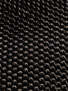 A close-up of a fiberglass material sample showcasing its texture and flexibility.