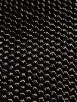 A close-up of high-tech fabric with a sleek design.