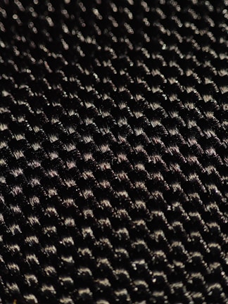 Close-up of the fabric texture of an ayxvetu bathing suit, highlighting its UV protection and water-resistant qualities.