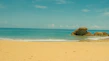 A serene beach scene on Santiago Island with crystal clear turquoise waters and golden sand.
