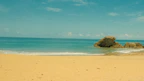 A serene beach scene on Santiago Island with crystal clear turquoise waters and golden sand.