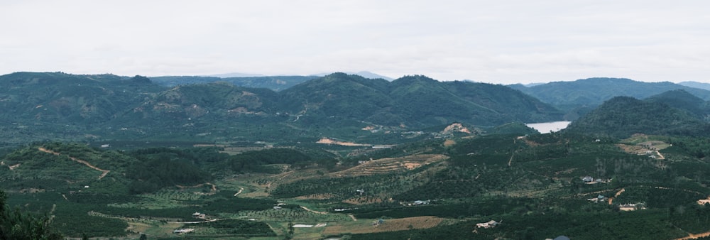 a view of a valley with mountains in the background