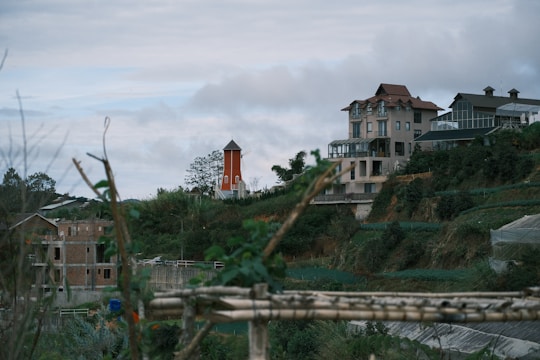 A happy Dutch family enjoying their new spacious villa terrace overlooking rolling hills and the Atlantic Ocean.