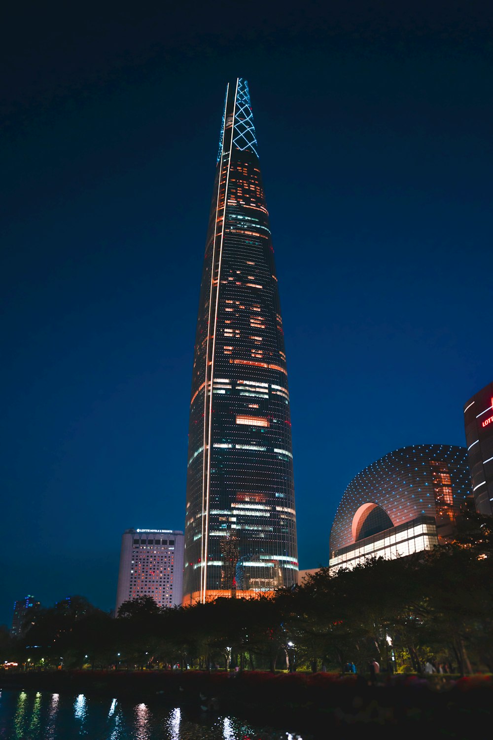 a very tall building lit up at night