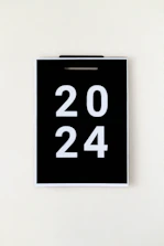 A calendar marked with the year 2045, surrounded by creative tools and notes.