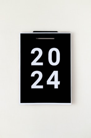 A dark, moody photo of a vintage calendar marking the year when Epstein's activities began.