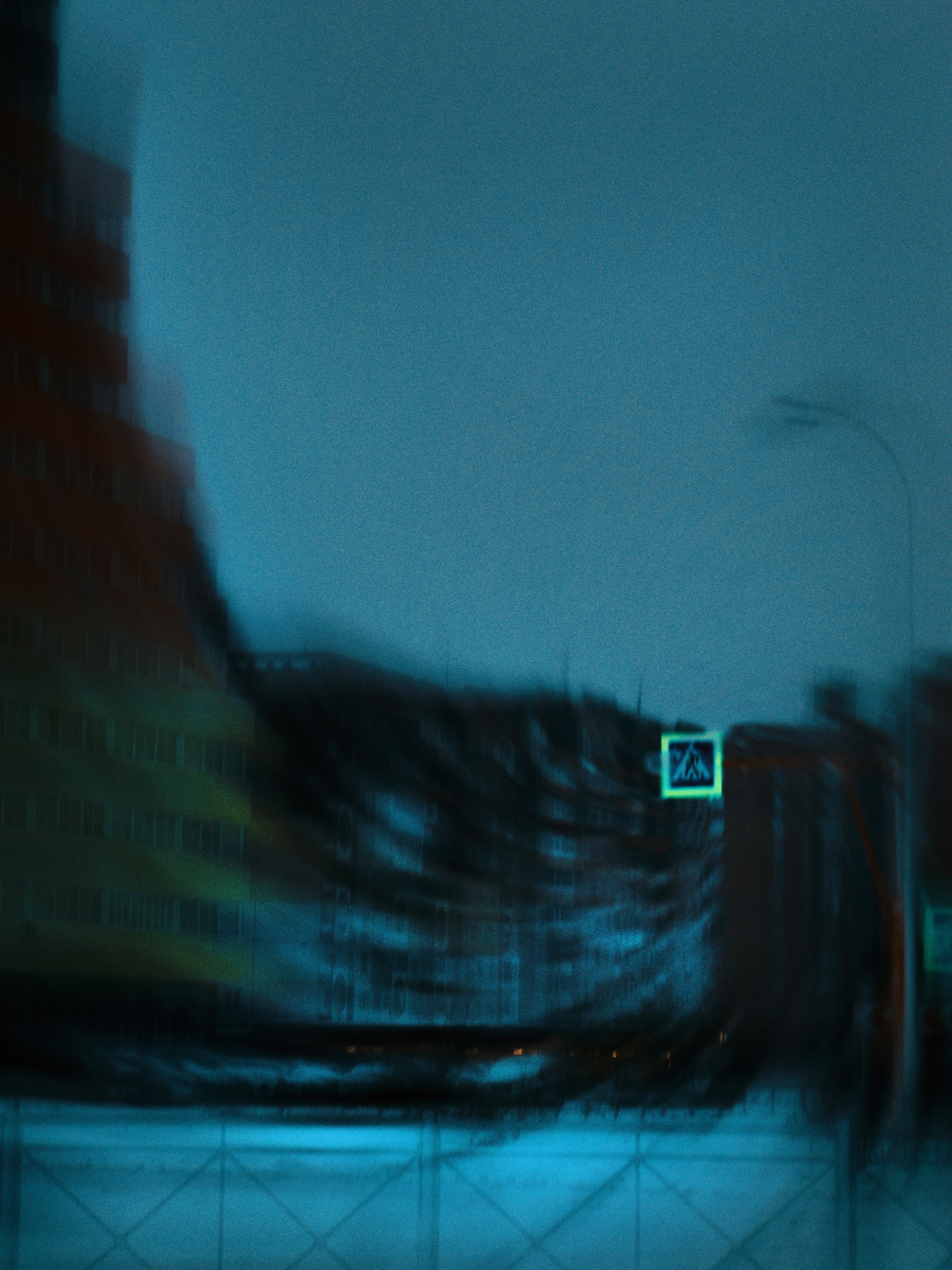 a blurry photo of a city street at night