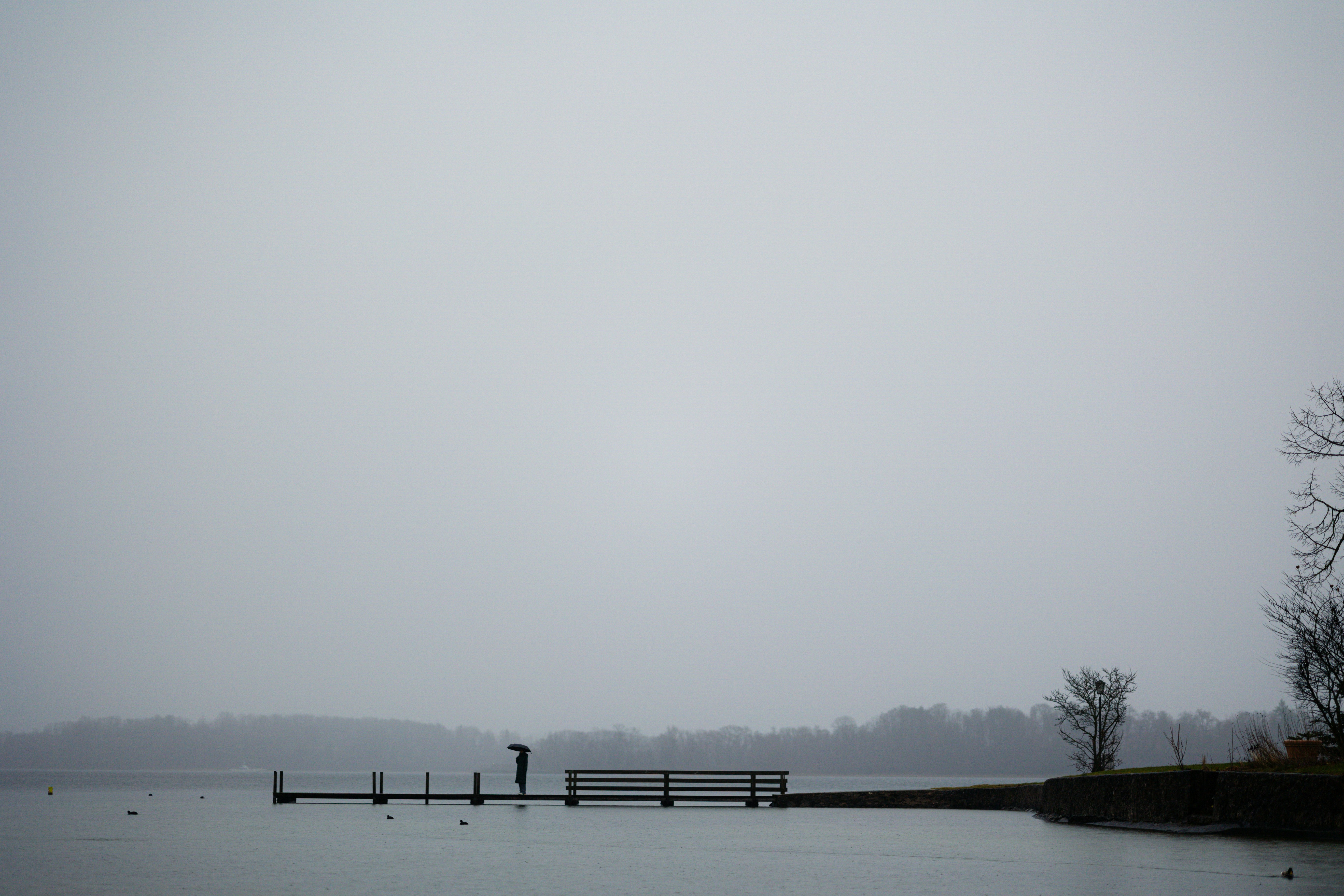 a body of water with a dock in the middle of it