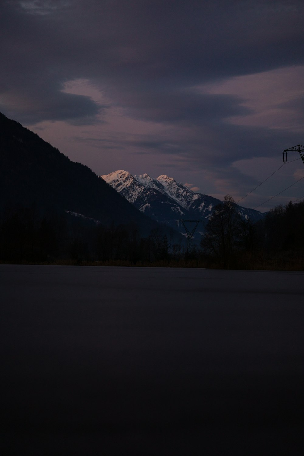 a view of a mountain range at night