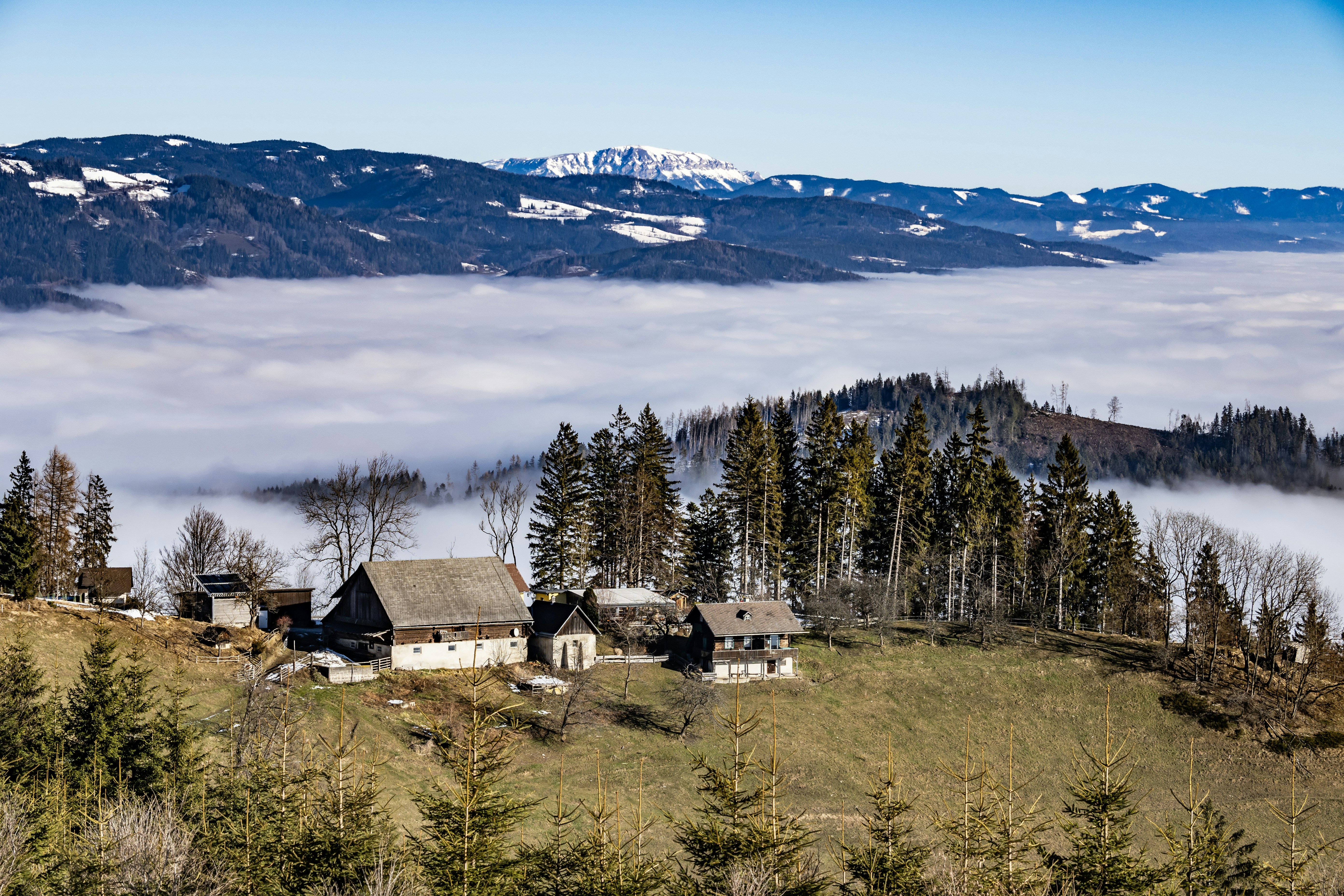 a view of a mountain with a house in the foreground