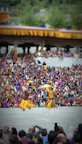 A colorful festival celebration in Tamil Nadu with traditional dancers.