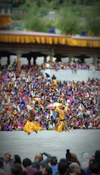 Students practicing traditional dance during a cultural event in colorful attire.