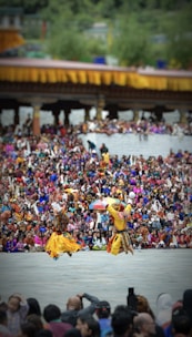 Dancers in traditional costumes captivating the audience during a festival break.