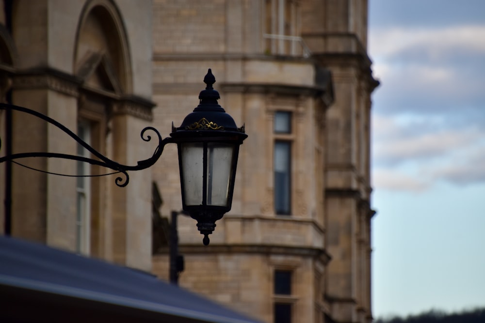 a street light hanging from the side of a building