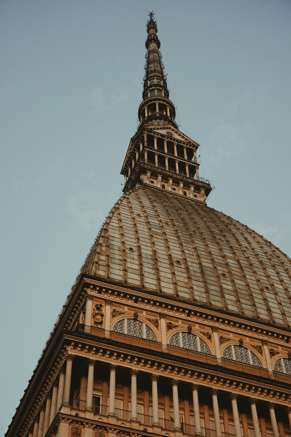 a tall building with a clock on the top of it