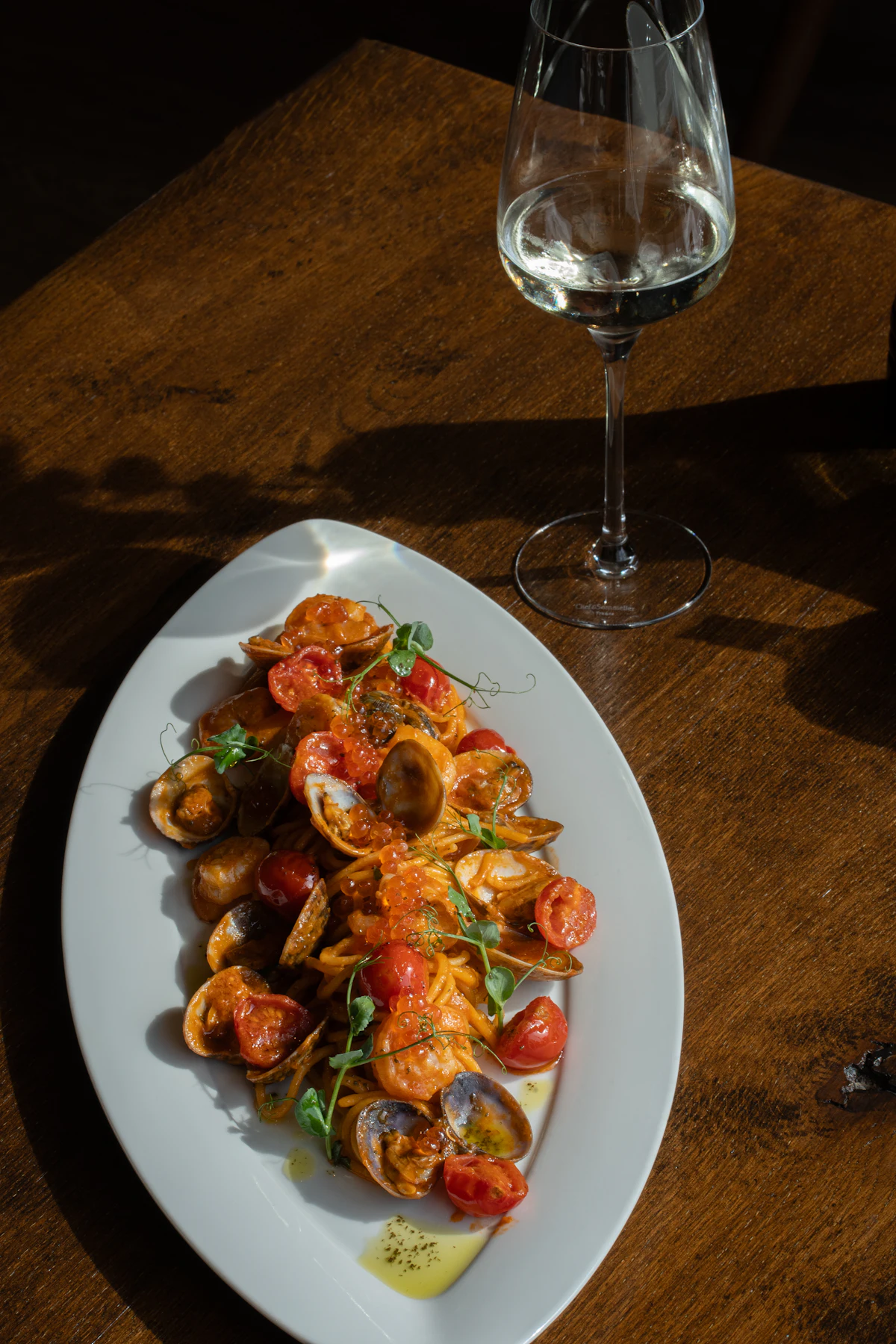 Plate of seafood with a glass of wine