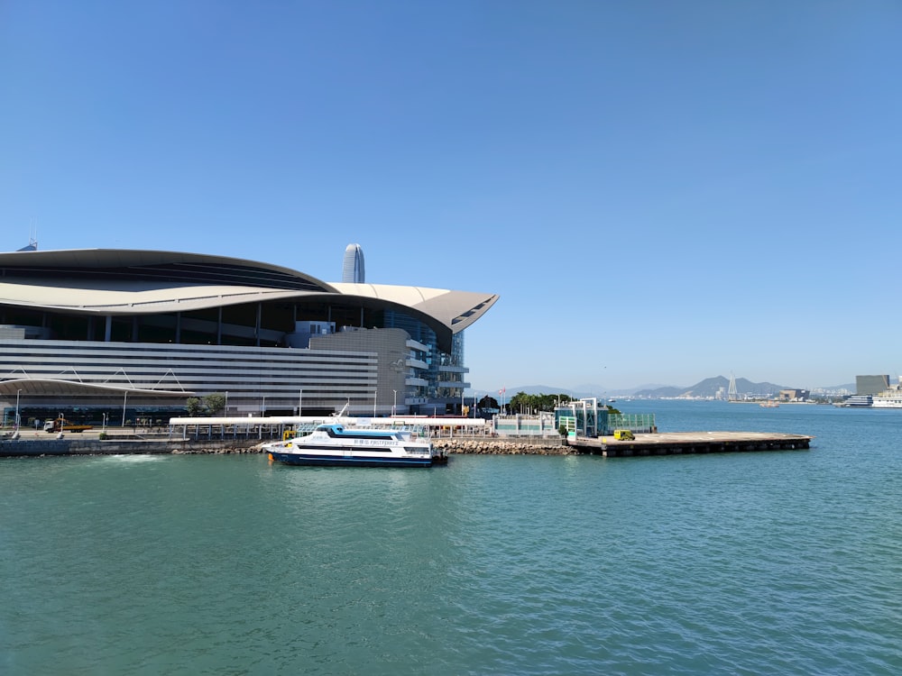 a large building sitting next to a large body of water