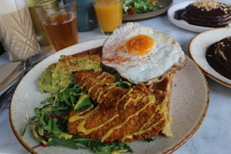 A cozy corner of baawk chicken & waffles with a rustic wooden table and a plate of crispy chicken and golden waffles.