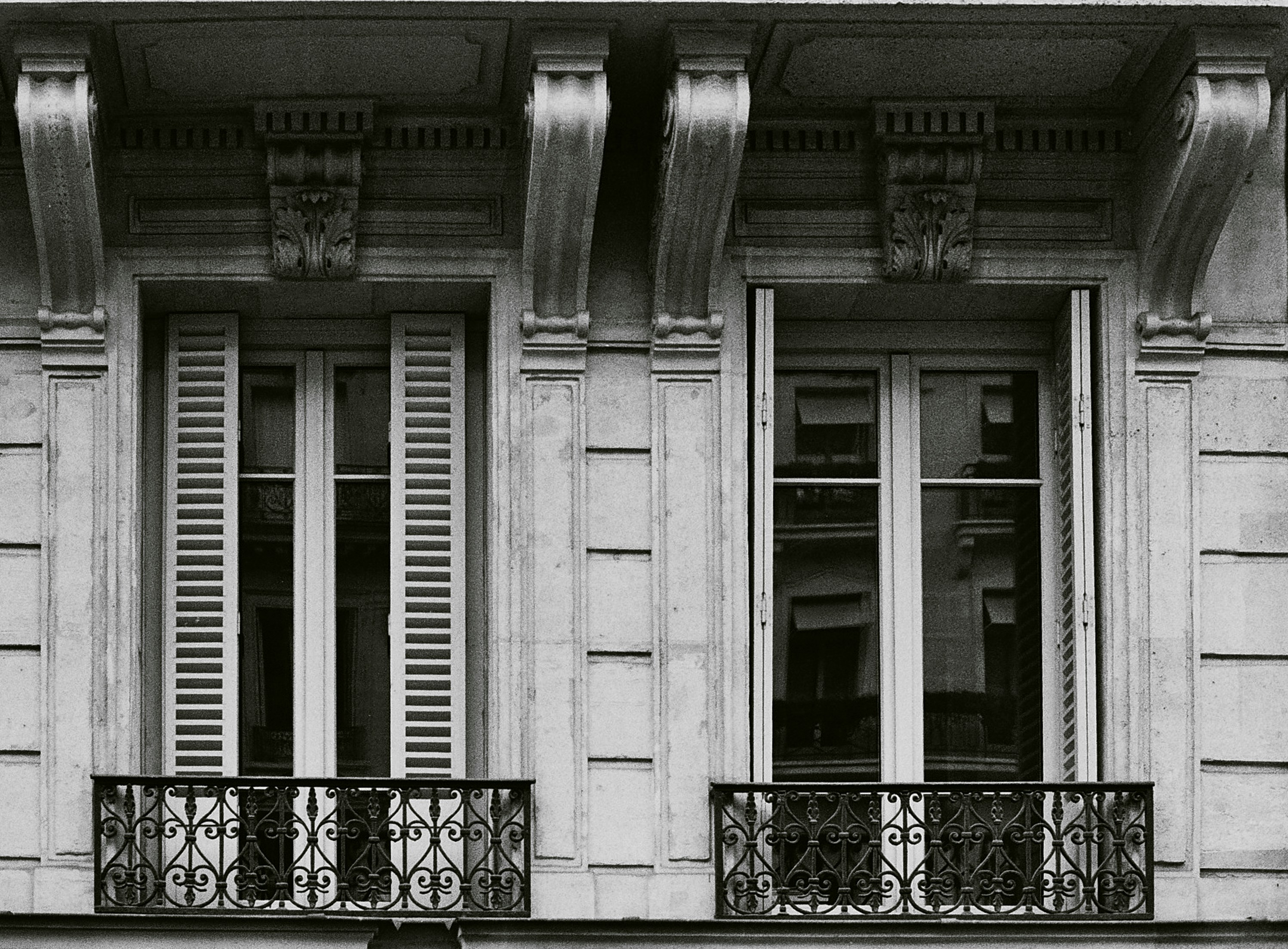 a black and white photo of a building with windows