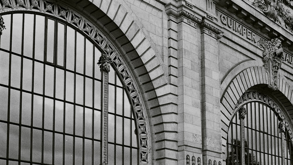 a black and white photo of a train station