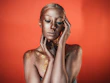 a woman with gold paint on her body