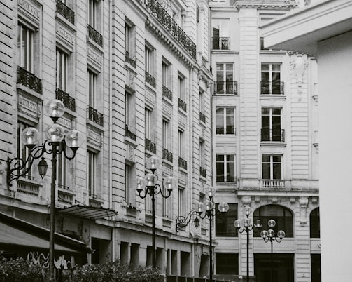 Vintage photograph of a 19th-century Barcelona street showcasing architectural styles.