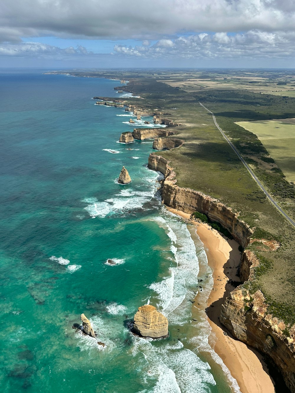 an aerial view of the coastline of the great ocean road