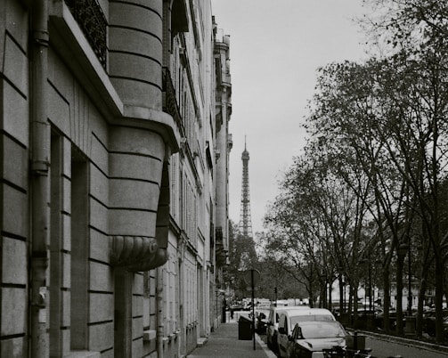 A sleek, black-and-white photo of a vibrant Parisian public square redesigned with clean lines and modern urban elements.