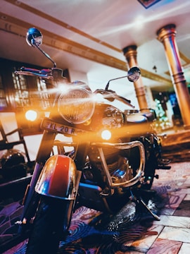 A classic motorcycle gleaming under garage lights, engine polished to perfection.