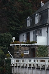 A freshly renovated traditional slate roof on a charming countryside house.