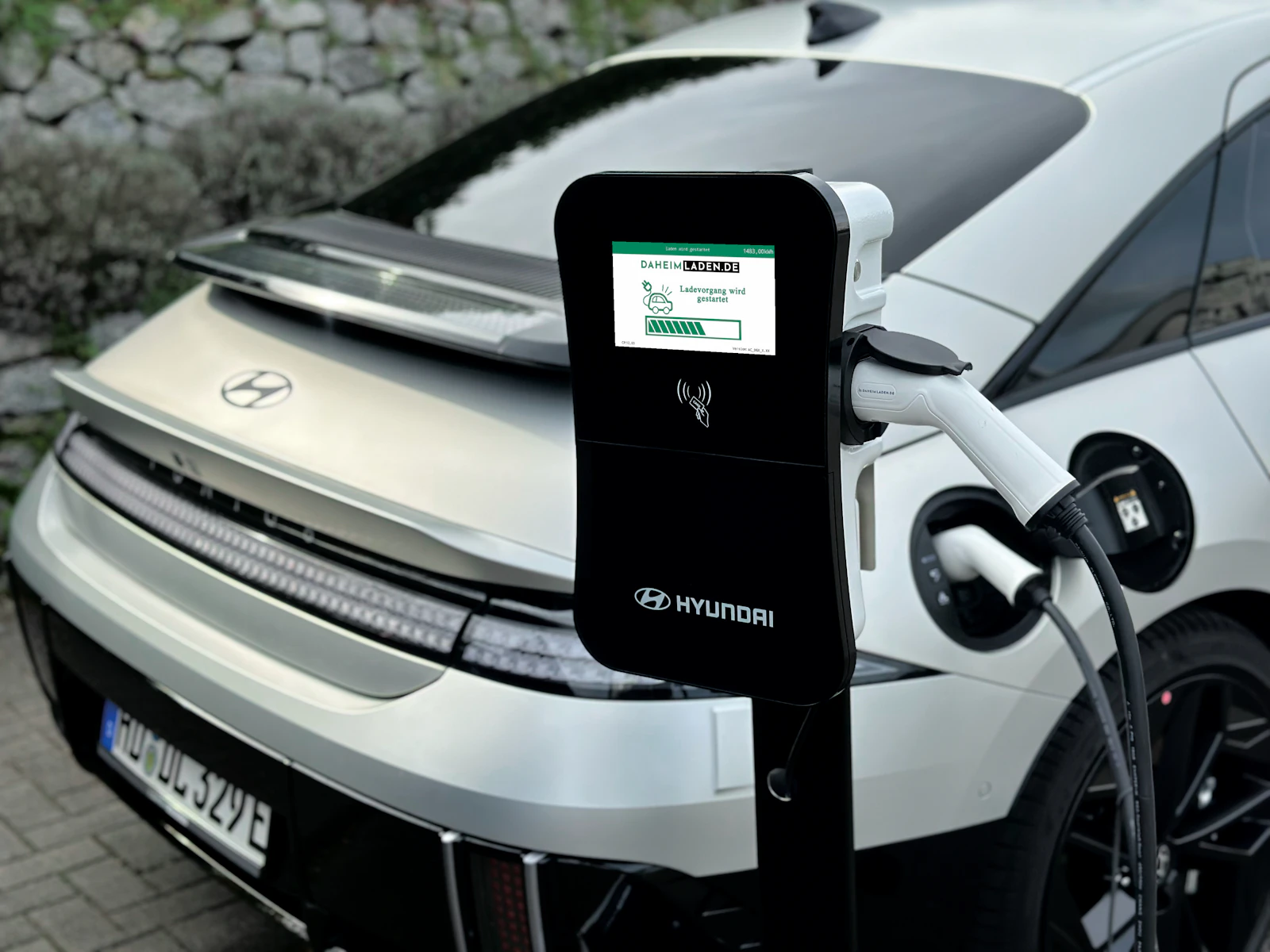 Electric vehicle plugged into a DC fast charger