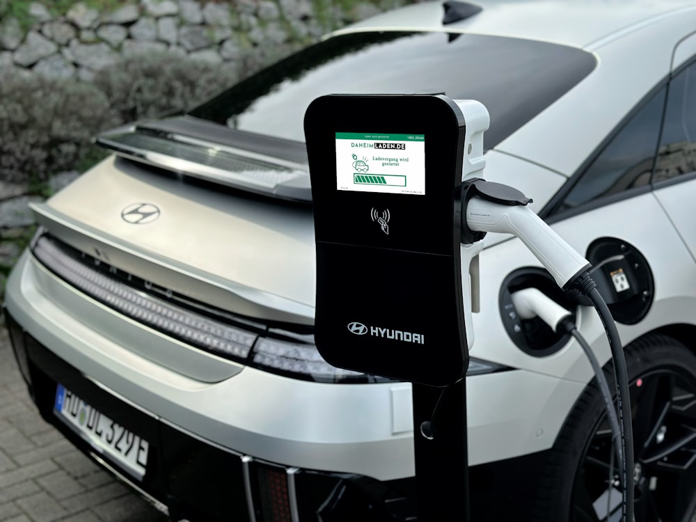 an electric car plugged in to a charging station