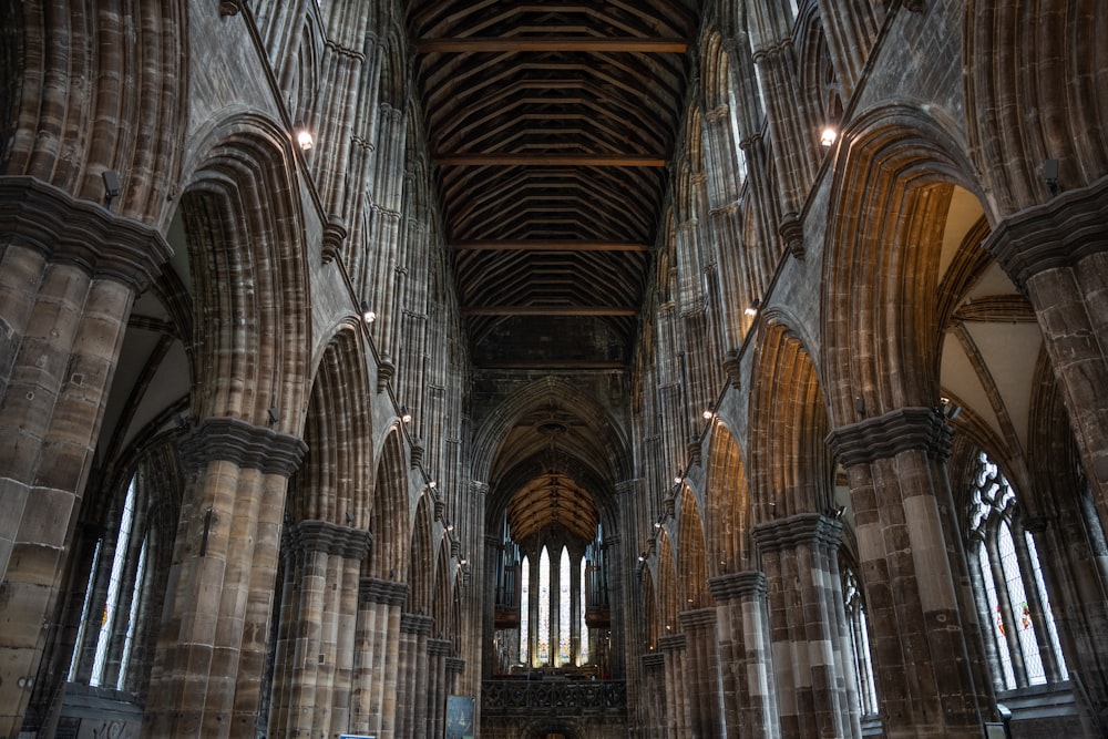 the interior of a large cathedral with stone columns
