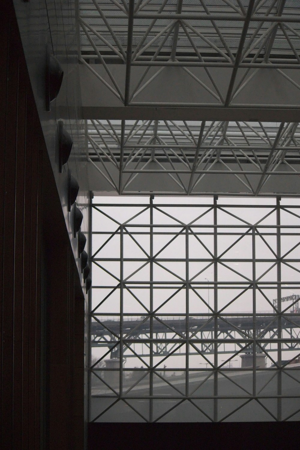 a view of a bridge from inside a building