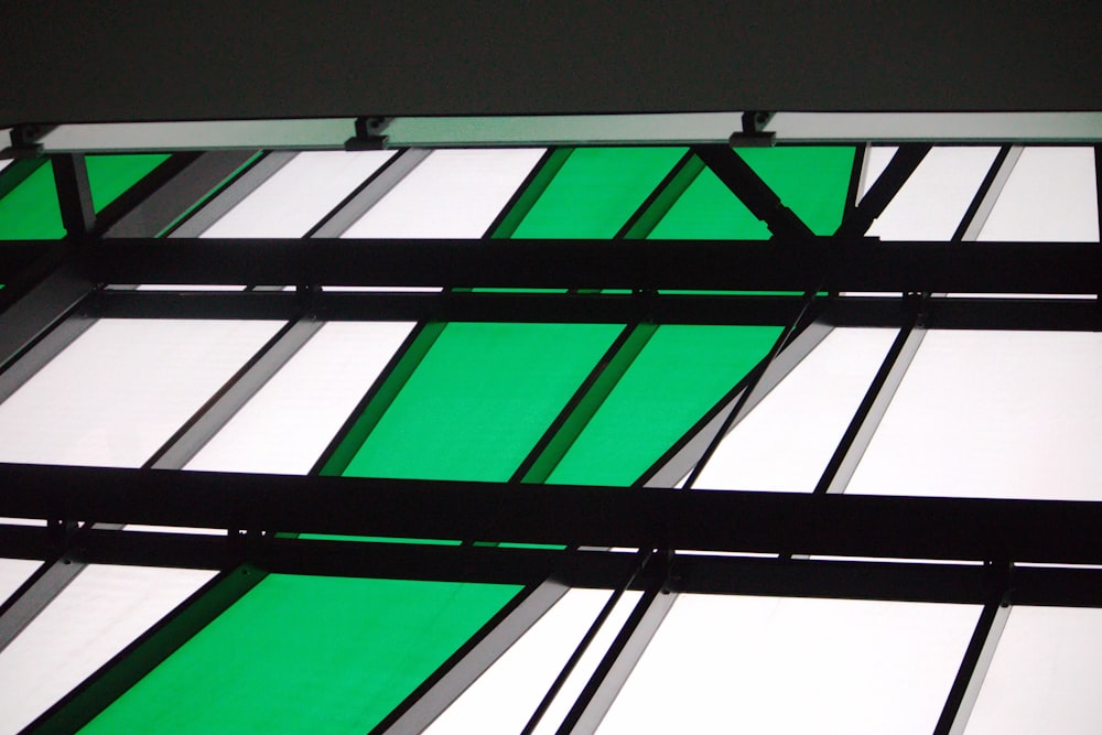 a close up of a green and white window