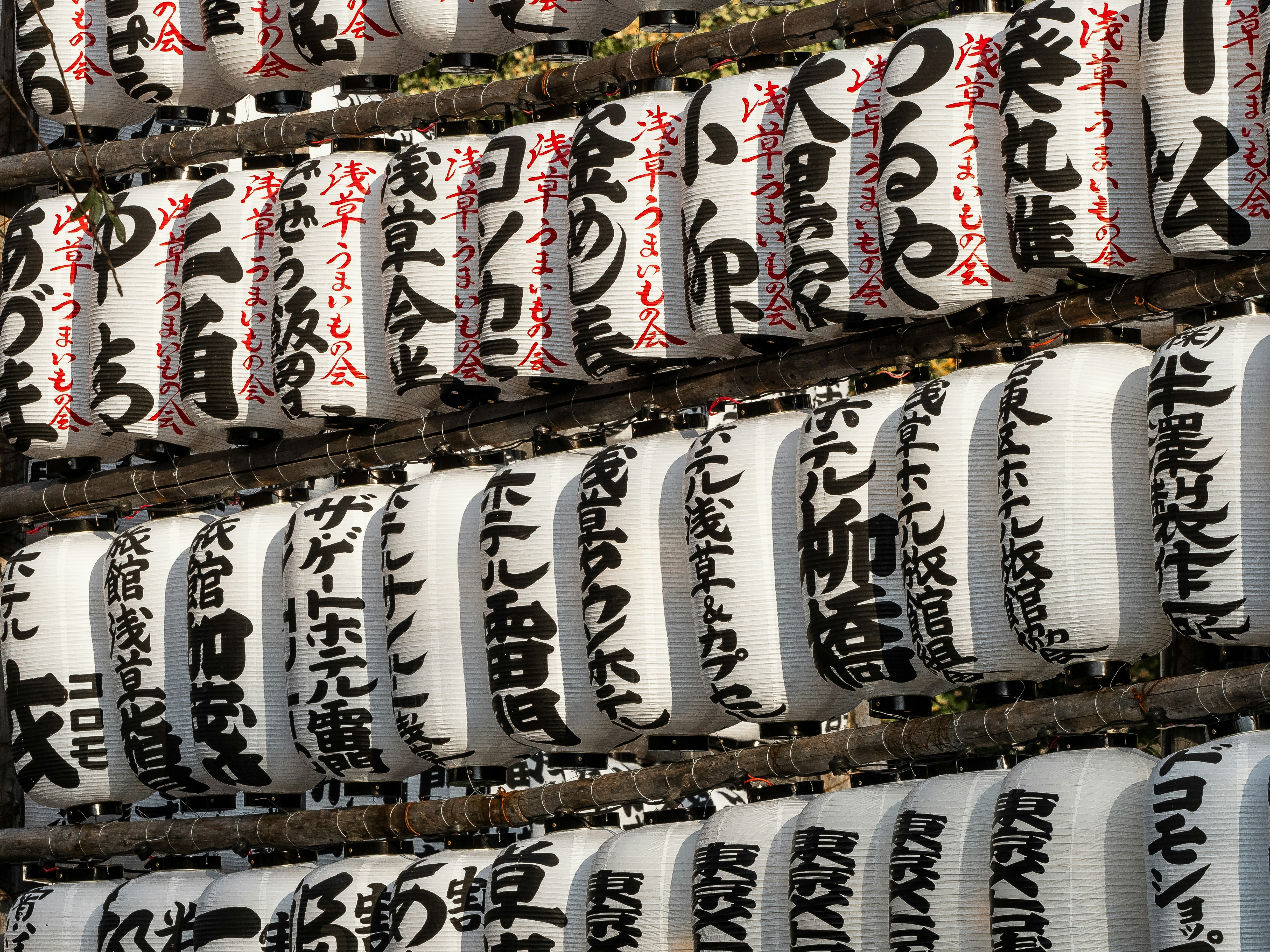 Close-up of non-slip winter boots on an icy Japanese pavement