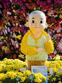 Flower Jimmy in a playful pose surrounded by colorful game elements.