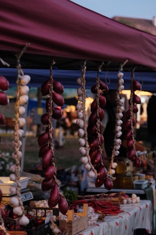 a bunch of food is hanging from a tent