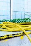 a bunch of yellow hoses sitting on top of a table