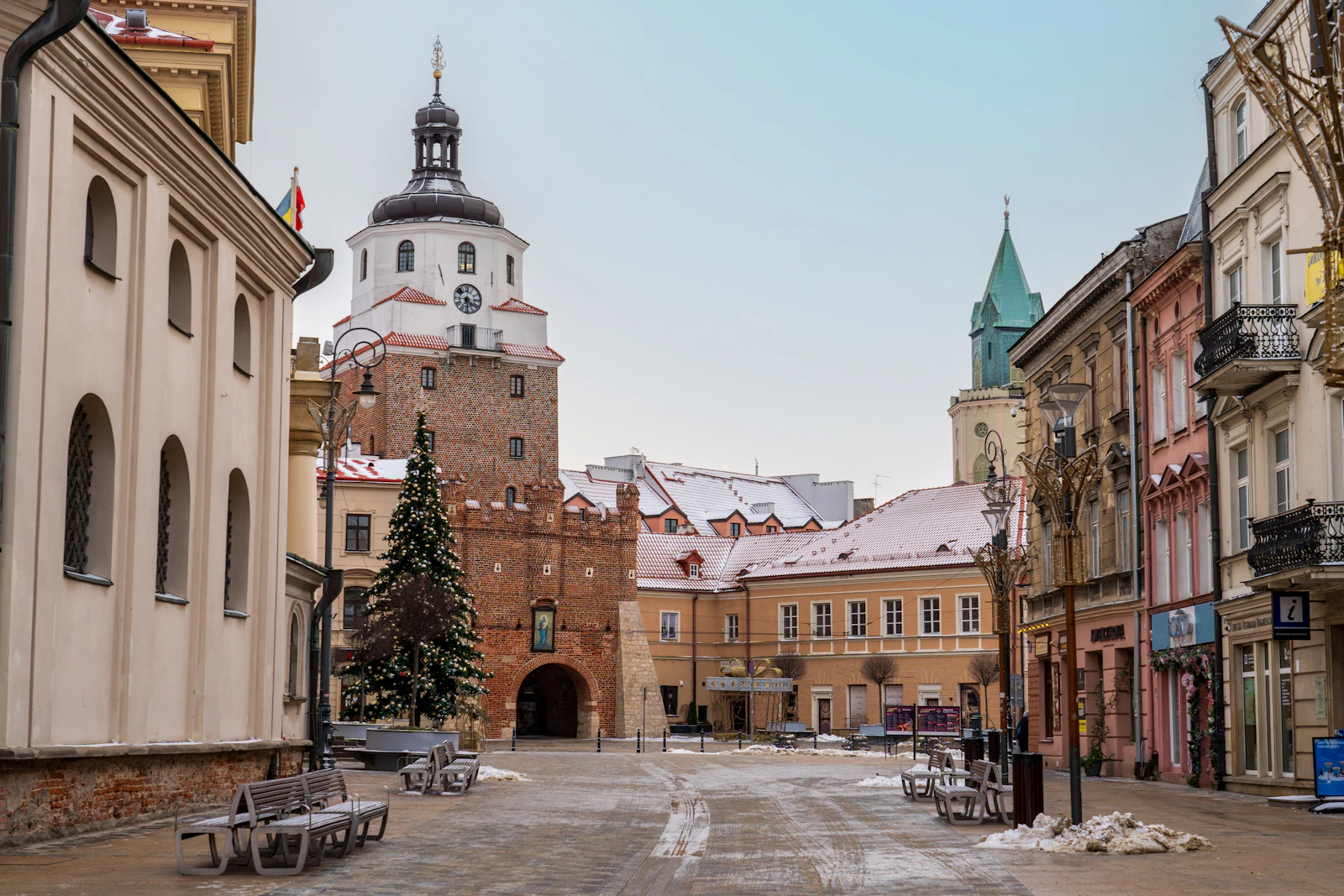 The Kraków Gate and the old town under snow — Lublin, Poland