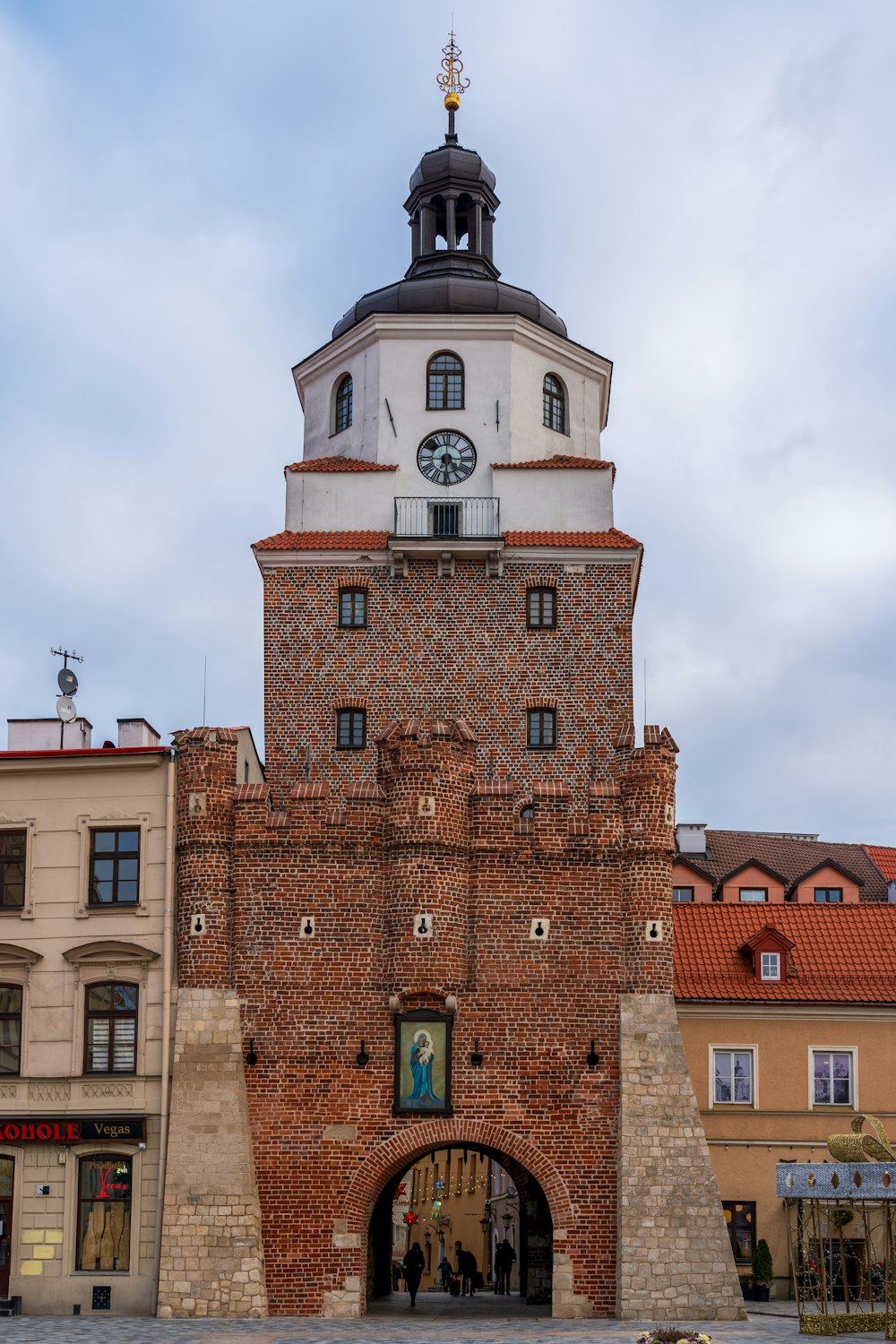 a tall brick building with a clock tower on top