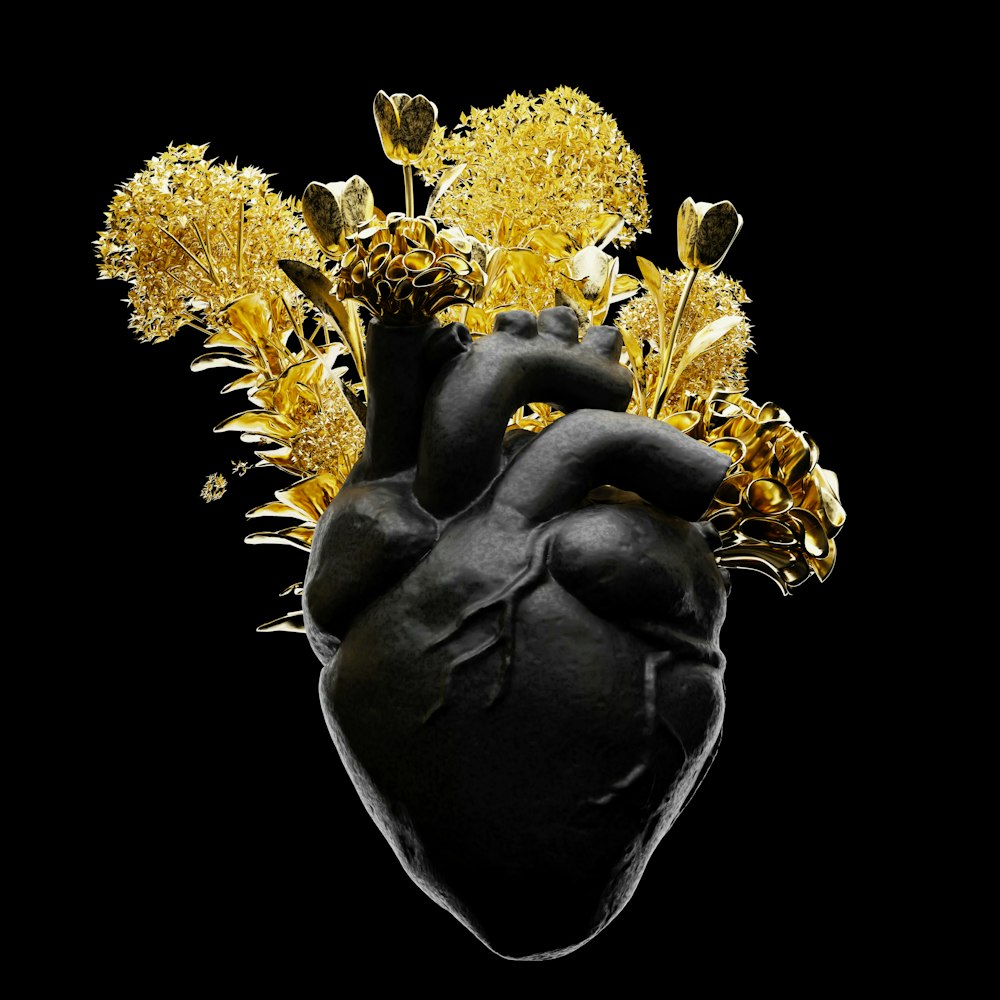 a black heart with yellow flowers on a black background