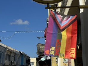 The welcoming entrance of the Milan-Easy club venue, decorated with international flags symbolizing our diverse community.