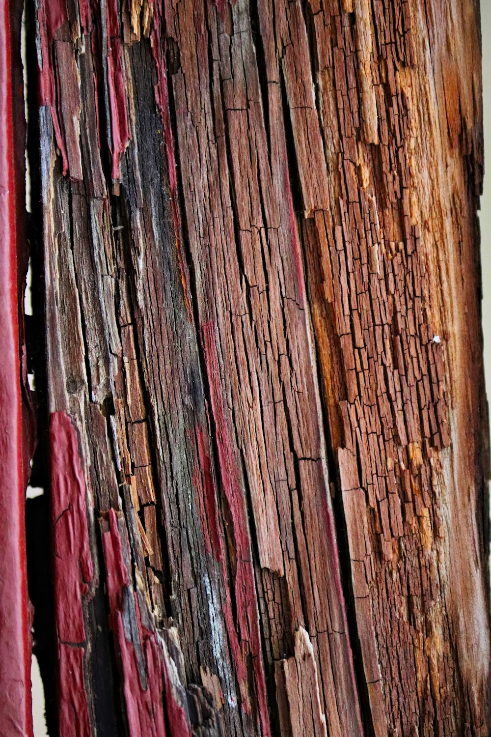 a close up of a piece of wood with red paint